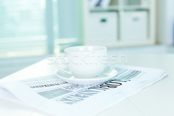 Cup and business newspaper Stock photo © pressmaster