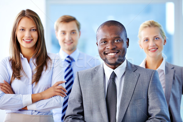 Líder equipo de negocios retrato mirando cámara tres Foto stock © pressmaster