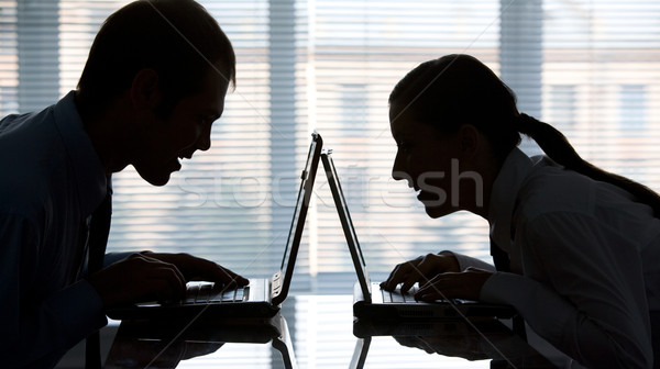 Dos hombre mujer escribiendo laptops oficina Foto stock © pressmaster