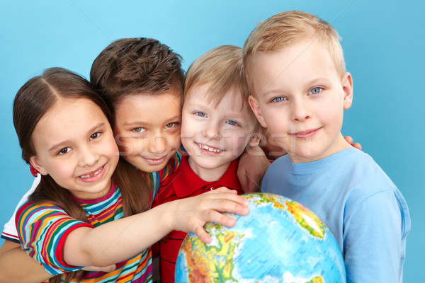 Cute kids with globe Stock photo © pressmaster