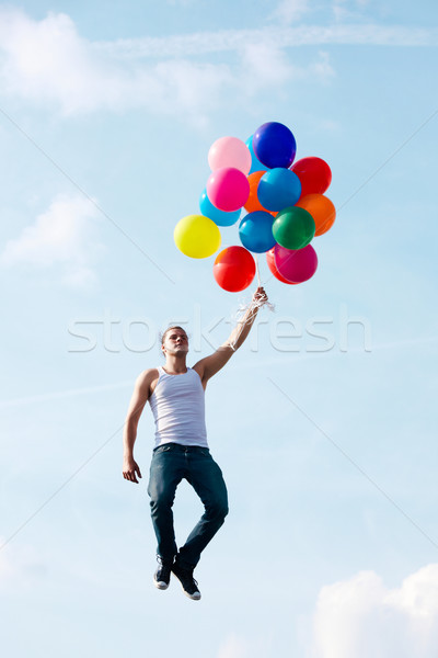 Wolności obraz młody człowiek kolorowy balony jasne Zdjęcia stock © pressmaster
