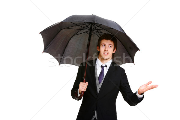 Imagine de stoc: Protecţie · imagine · elegant · om · de · afaceri · negru · umbrelă