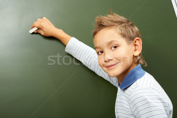 Boy at blackboard Stock photo © pressmaster