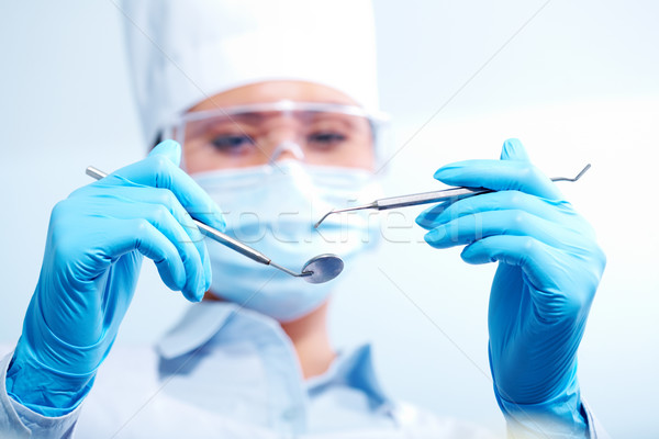 Dentiste image médicaux outils femme main Photo stock © pressmaster