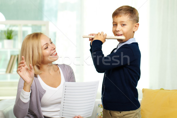Jouer flûte portrait heureux tuteur femme Photo stock © pressmaster