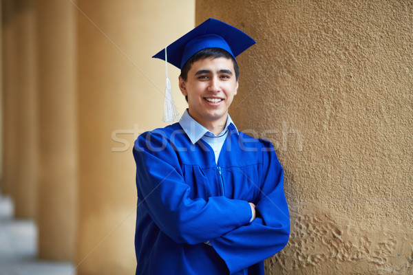 Guy in graduation gown Stock photo © pressmaster