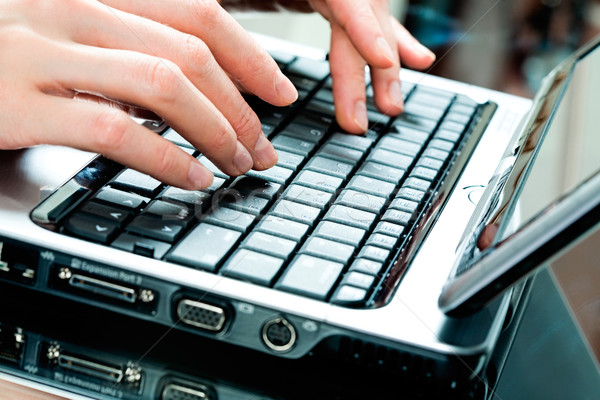 Hands typing on laptop Stock photo © pressmaster