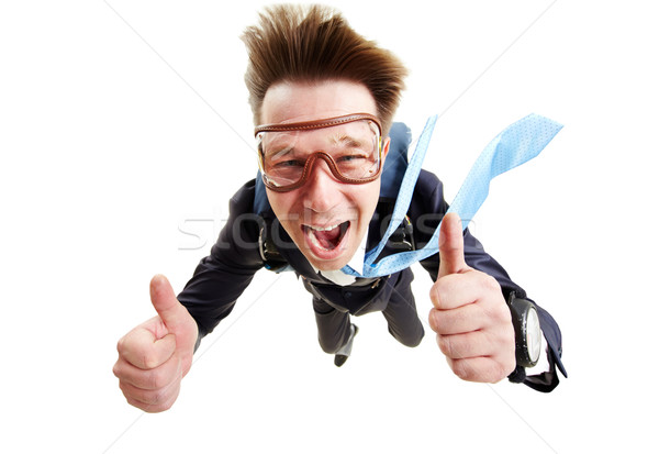 Imagen feliz hombre vuelo paracaídas Foto stock © pressmaster