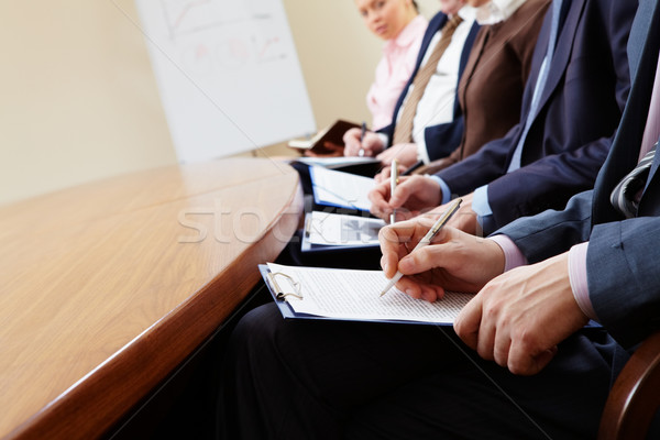 écrit conférence gens d'affaires mains documents Photo stock © pressmaster