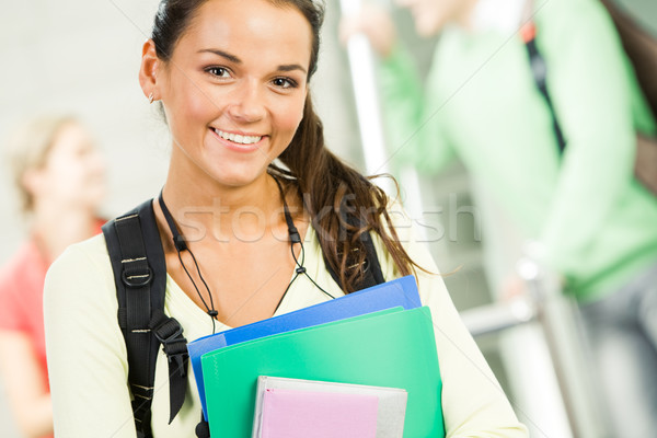 Ziemlich Teenager Bild lächelnd Studenten halten Stock foto © pressmaster
