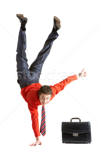 Photo of isolated young man showing sign of okay while keeping on right arm Stock photo © pressmaster