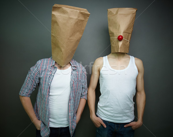 Guys in paper bags Stock photo © pressmaster
