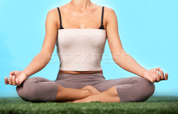 Meditating on grass Stock photo © pressmaster