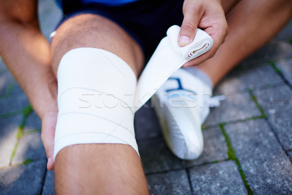 Bandaging leg Stock photo © pressmaster