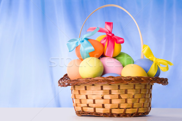 Basket with colorful eggs Stock photo © pressmaster