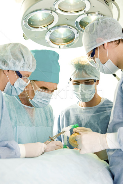операция изображение четыре человека хирургический одежды Постоянный Сток-фото © pressmaster