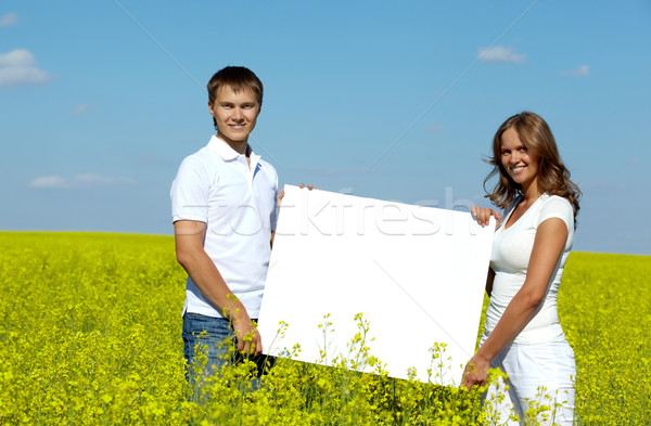 Noticias retrato feliz papel en blanco pie Foto stock © pressmaster