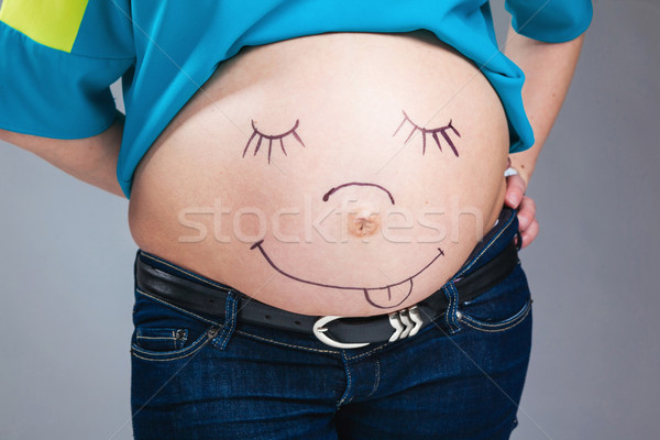 Göbek hamile kadın gülümseme kadın eller arka plan Stok fotoğraf © prg0383