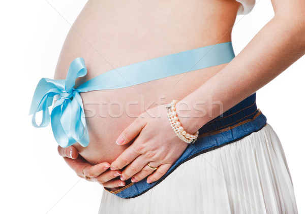 Pregnant belly with blue ribbon - isolated over a white backgrou Stock photo © prg0383