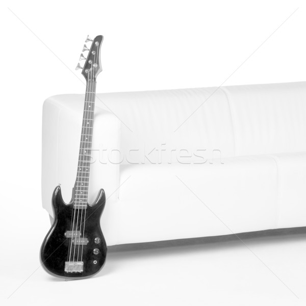 black bass guitar and white couch Stock photo © prill