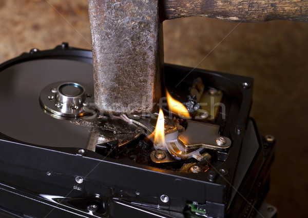 hammer and burning hard disks Stock photo © prill