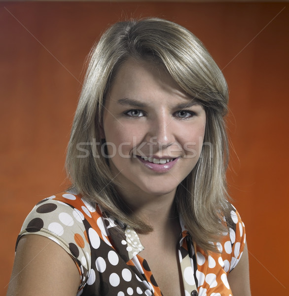 smiling young girl portrait in brown back Stock photo © prill