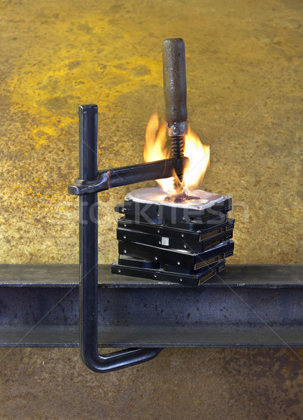 burning vise and hard disks Stock photo © prill