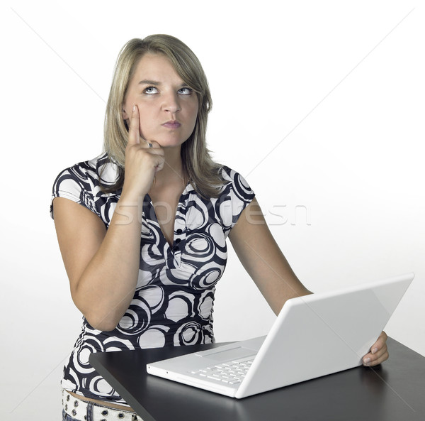 thinking cute girl above a laptop Stock photo © prill