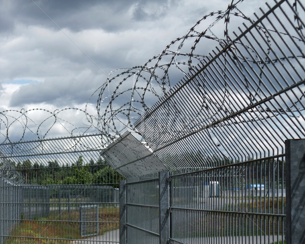 safety fence and dramatic sky Stock photo © prill