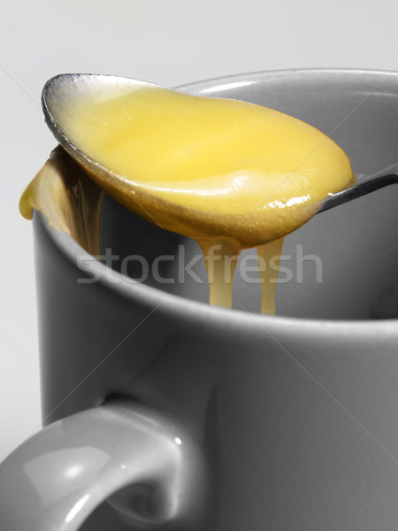 Tasse miel cuillère partie gris détail Photo stock © prill