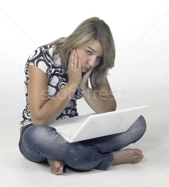 bored girl sitting on the floor with white laptop Stock photo © prill