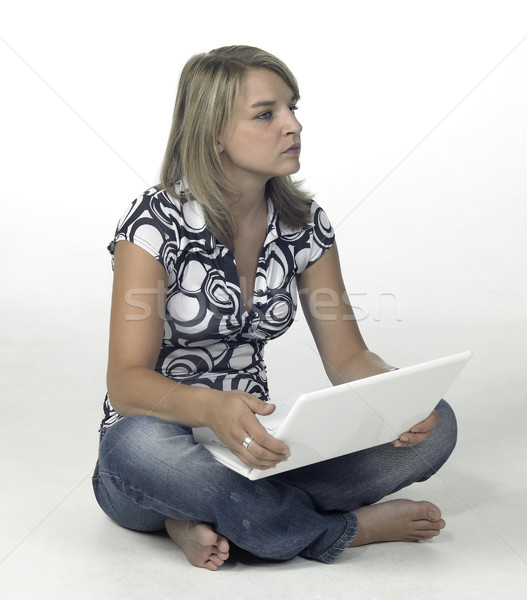 cute blonde computing girl - contemplative Stock photo © prill