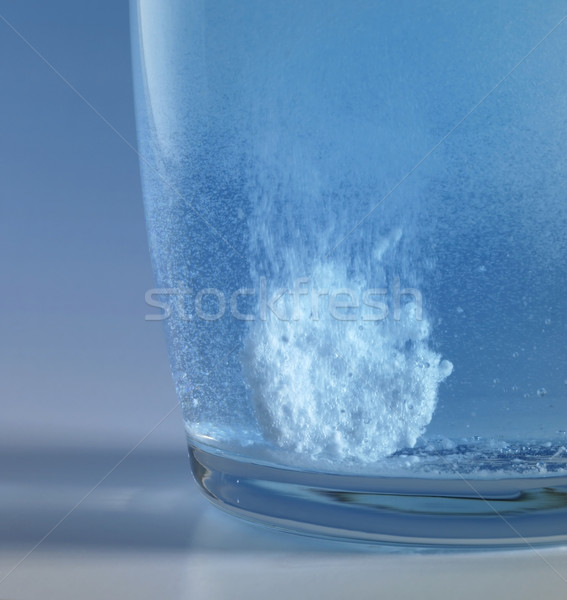 Stock photo: fizzy tablet in a glass of water