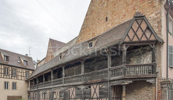 Történelmi erkély fából készült régi épület épület építkezés Stock fotó © prill