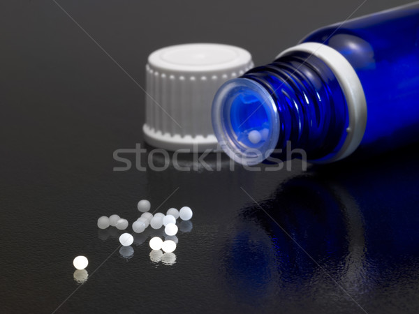 small blue bottle and globules Stock photo © prill