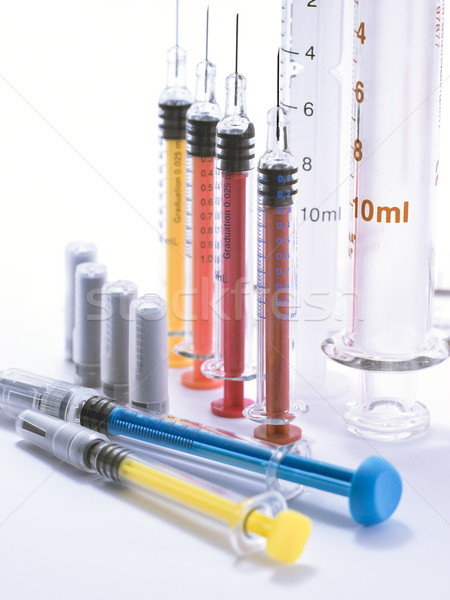 Syringes of different colors Stock photo © Pruser