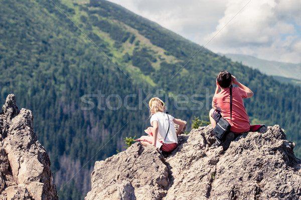 Children sitting on mountain peak Stock photo © przemekklos