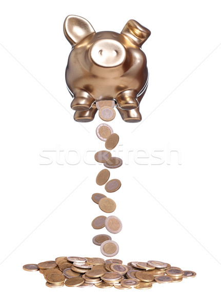 Stock photo: coins falling out of golden piggybank