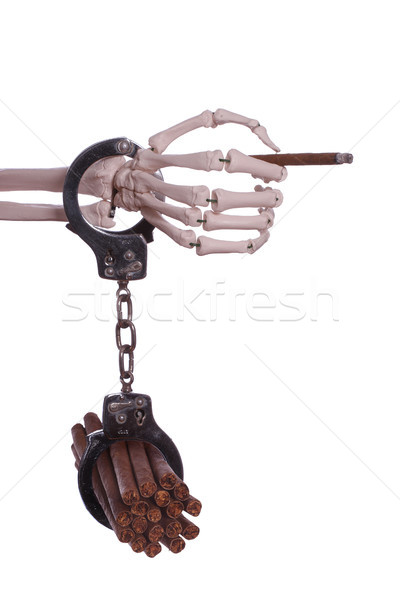 skeleton hand holding cigar with handcuff Stock photo © pterwort