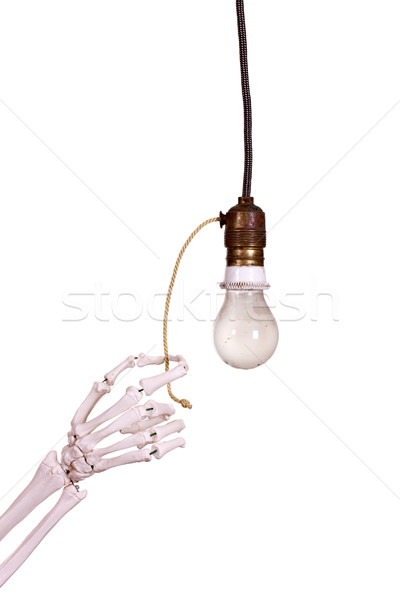 Stock photo: old buld socket with skeleton hand