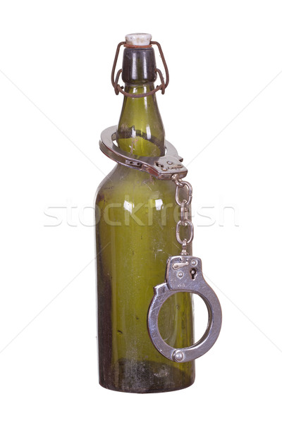 old bottle captured with handcuff Stock photo © pterwort