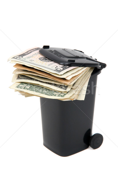 batch of bank notes in black rubbish bin on white Stock photo © pterwort