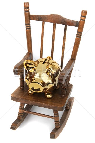 old wooden rocking chair and golden piggy bank on white Stock photo © pterwort