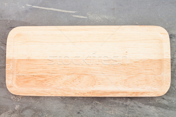 Wooden plate on grey background Stock photo © punsayaporn