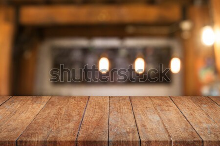 Brown wooden table top with coffee shop Stock photo © punsayaporn