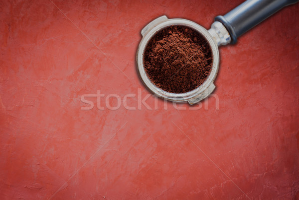 Stock photo: Coffee grind in group on red concrete background