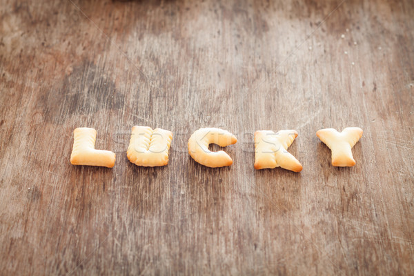 Afortunado alfabeto galleta mesa de madera stock foto Foto stock © punsayaporn