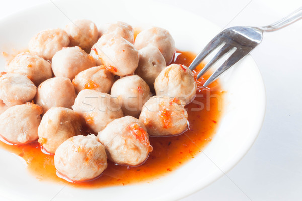 Stock photo: Mini pork balls in orange dish on clean table