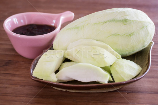 Green mango serving with sweet sauce Stock photo © punsayaporn