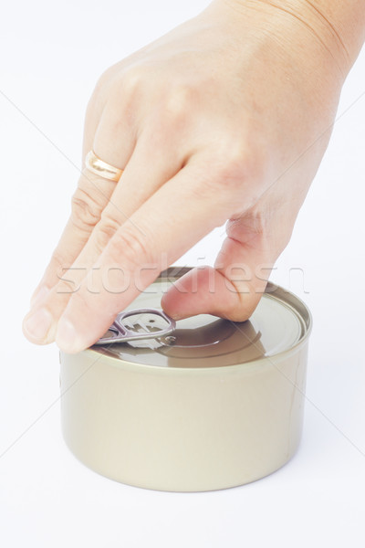 Close-up tin can with hand isolated on white background  Stock photo © punsayaporn